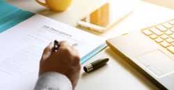 writing a job description at a desk